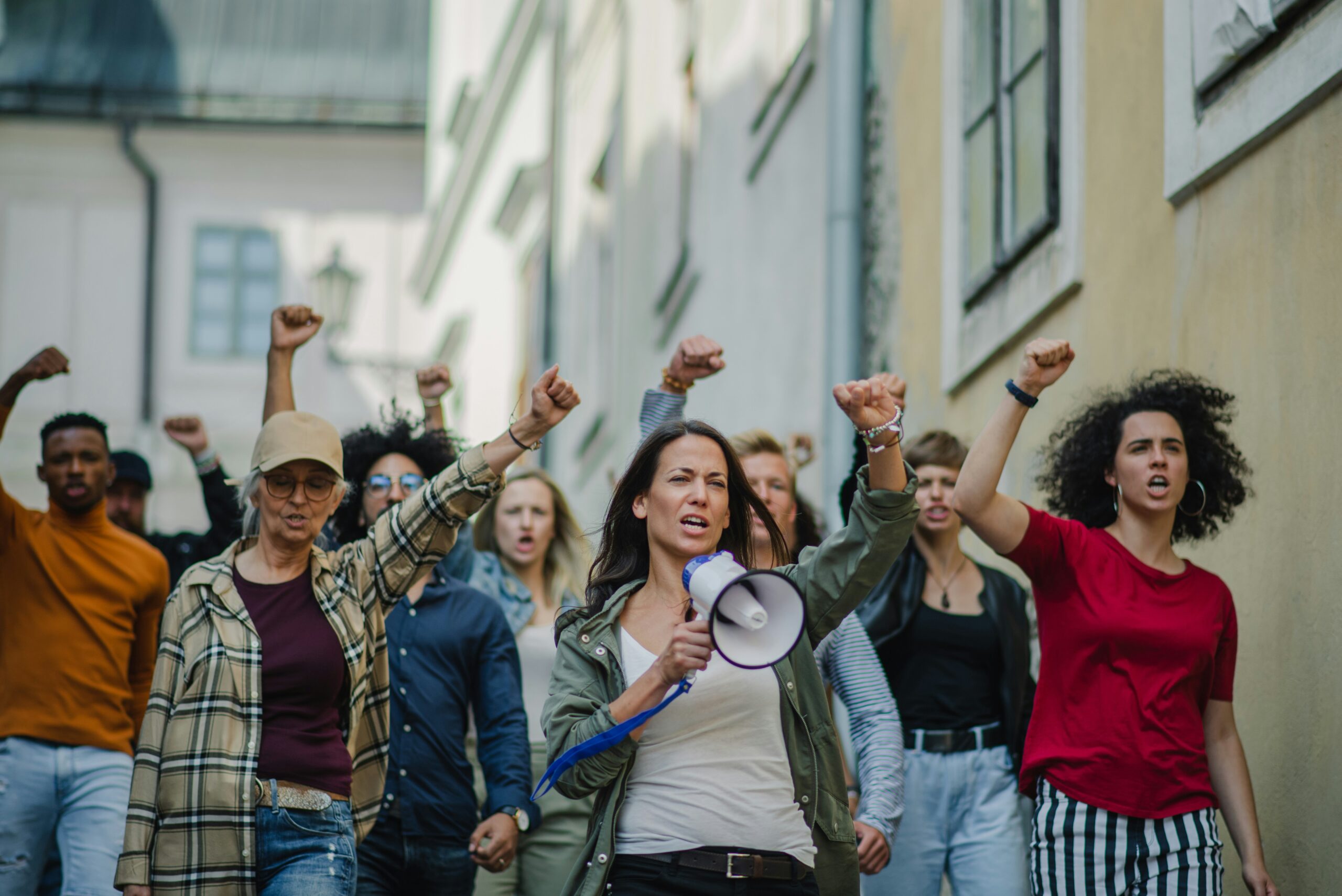 photo of a group of people with fists in the air.